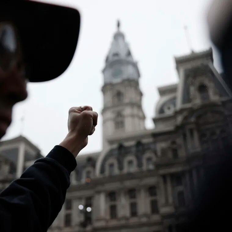 A pro-Palestinian demonstrator joins a cease-fire march beginning at City Hall in Philadelphia on Saturday, March 2, 2024.
