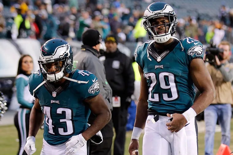 DeMarco Murray and Darren Sproles leave the field after losing to the Tampa Bay Buccaneers.