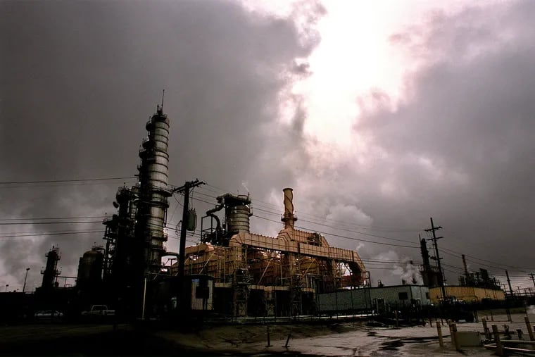 A view of the Chevron refinery under storm clouds in El Segundo, California. In mid-February, hackers gained access to computers belonging to current and former employees at nearly two dozen major natural gas suppliers and exporters, including Chevron. (Genaro Molina/Los Angeles Times/TNS)