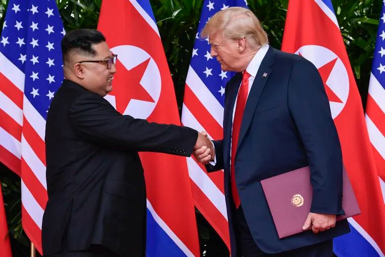 FILE - In this June 12, 2018, file photo, North Korea leader Kim Jong Un, left, and U.S. President Donald Trump shake hands at the conclusion of their meetings at the Capella resort on Sentosa Island in Singapore. To hear a beaming Donald Trump at his June summit with Kim Jong Un in Singapore, the solution to North Korea’s headlong pursuit of nuclear weapons, a foreign policy nightmare that has flummoxed U.S. leaders since the early 1990s, was at hand. (AP Photo/Susan Walsh, Pool, Fie)