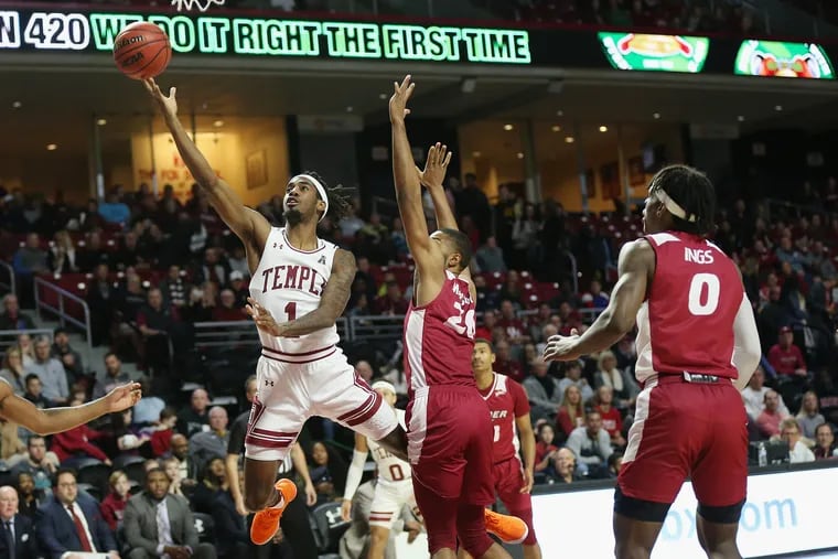 Temple guard Quinton Rose (1) goes for a layup past Rider center Tyere Marshall (20) during a game at the Liacouras Center in North Philadelphia on Saturday, Dec. 21, 2019.