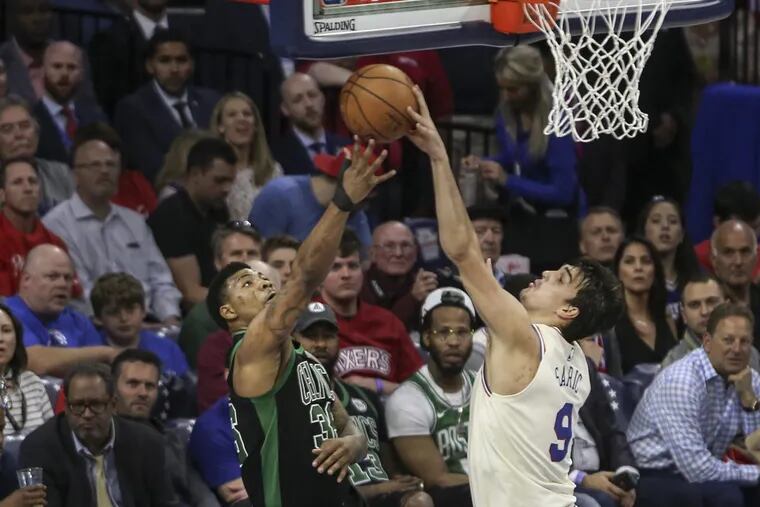 Dario Saric blocks a shot by the Celtics’ Marcus Smart during the second quarter of Game 4 on Monday.