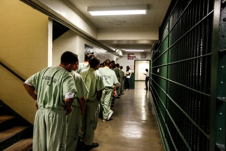 A line at the Men's Central Jail forms as inside the general area where inmates take breaks are waiting to be helped by the ACLU of Southern California, who are registering inmates that are eligible to vote.