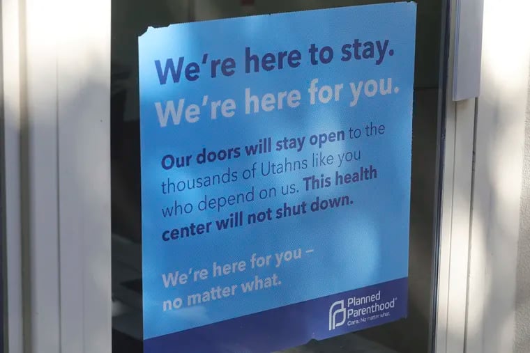 A sign is displayed on the door of Planned Parenthood of Utah Wednesday, Aug. 21, 2019, in Salt Lake City. About 39,000 people received treatment from Planned Parenthood of Utah in 2018 under a federal family planning program called Title X. The organization this week announced it is pulling out of the program rather than abide by a new Trump administration rule prohibiting clinics from referring women for abortions.