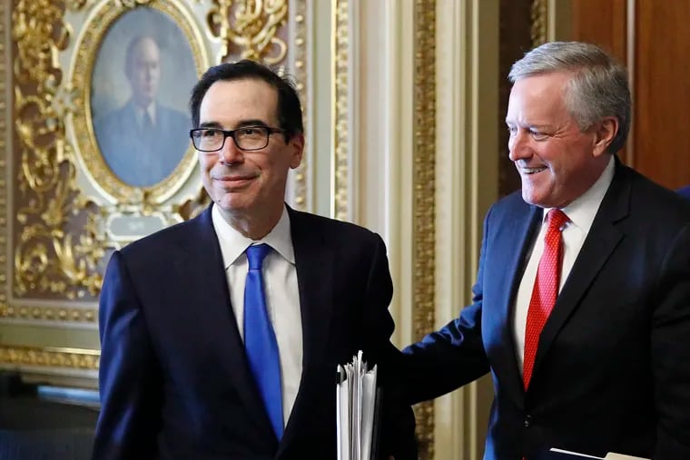 Treasury Secretary Steve Mnuchin, left, and acting White House chief of staff Mark Meadows step out of a meeting on Capitol Hill in Washington on March 25, 2020.