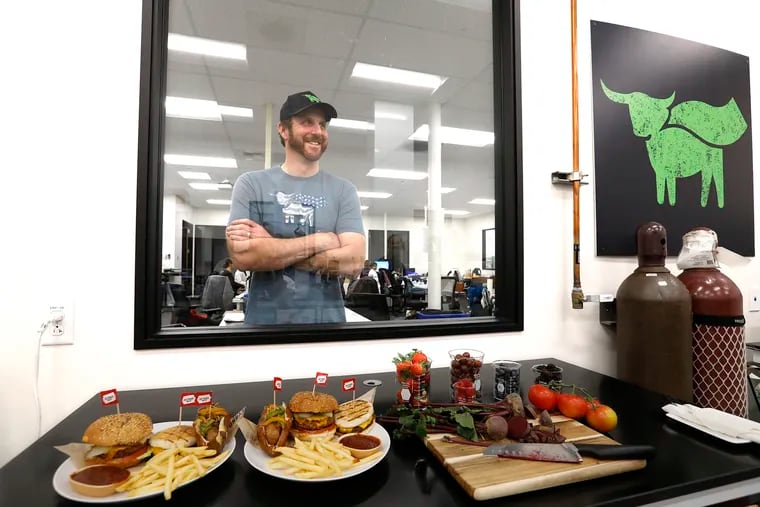 Ethan Brown, founder and CEO of Beyond Meat, stands behind some of their products including the Beyond Burger 2.0, at the company's headquarters in El Segundo, Calif., on February 11. The company's stock has been soaring since it went public in May.