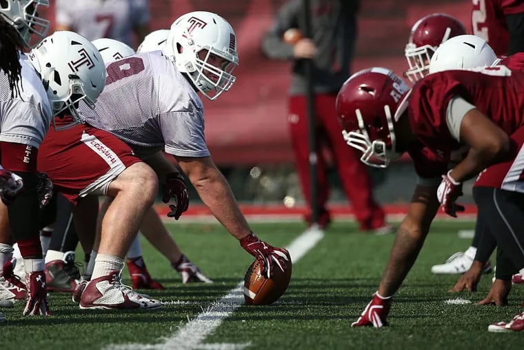 Center Kyle Friend prepares to hike the ball during the Temple football practice.