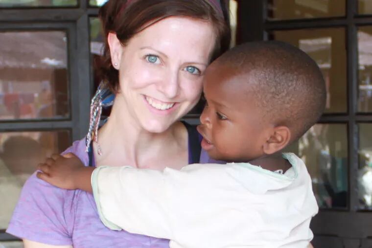 Terri Wingham, shown here with a child she met on a visit to Africa, founded A Fresh Chapter after a cancer diagnosis prompted her to reevaluate her life.