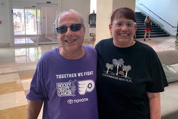 Julian (left) and Maryanne Loscalzo, former South Philly residents who now live in Bear, Del., drove 1,100 miles to attend the Flyers game in Tampa on Thursday and visit Phillies games in spring training. All were canceled.