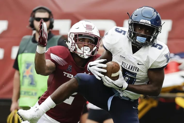Villanova wide receiver Jarrett McClenton (right) catches the football past Temple safety Delvon Randall during the fourth-quarter on Saturday, September 1, 2018. McClenton scored a touchdown after the catch. YONG KIM / Staff Photographer