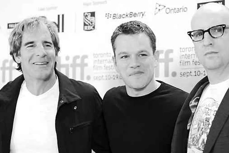 Matt Damon (center), who plays the title part, with fellow actor Scott Bakula (left) and director Steven Soderbergh in Toronto. Damon says the film, based on a thriller, was turned into a screwball farce because &quot;The Insider&quot; had come along first.