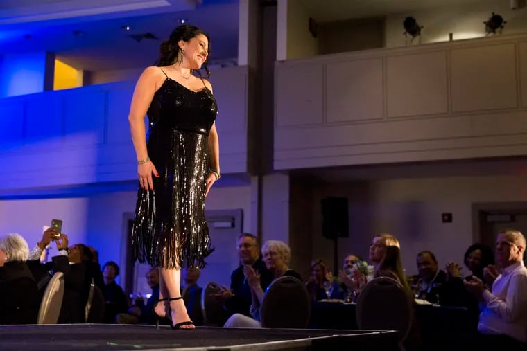Regina Mills, from Glassboro, NJ, walks in the Get Your Rear in Gear charity fashion show on February 27, 2020. Mills was diagnosed with rectal cancer at age 38.