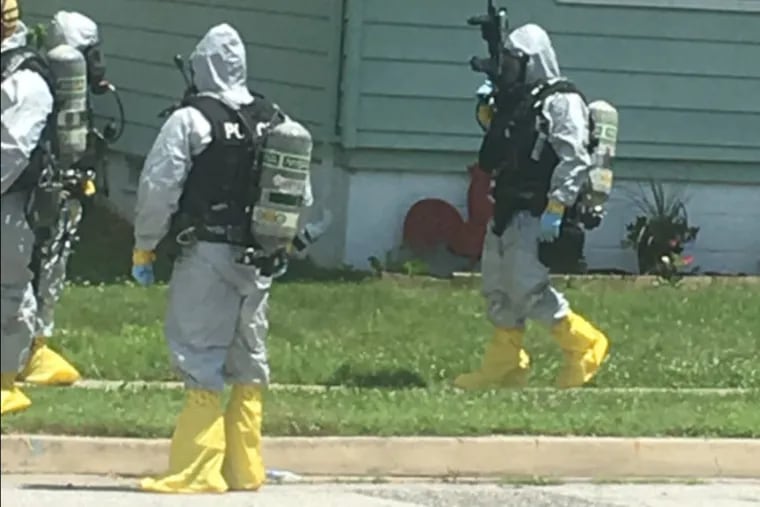 DEA agents suit up to handle fentanyl during a raid on a Carneys Point home.
