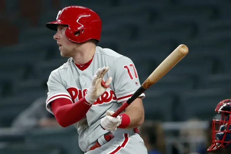 Rhys Hoskins (17) raps a two-out, two-run double in the 10th inning to lift the Phillies past the host Braves on Tuesday night, 5-1.