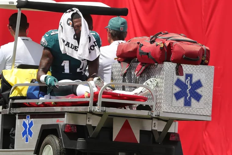 Mike Wallace leaves on a cart after injuring what appears to be a serious ankle injury.