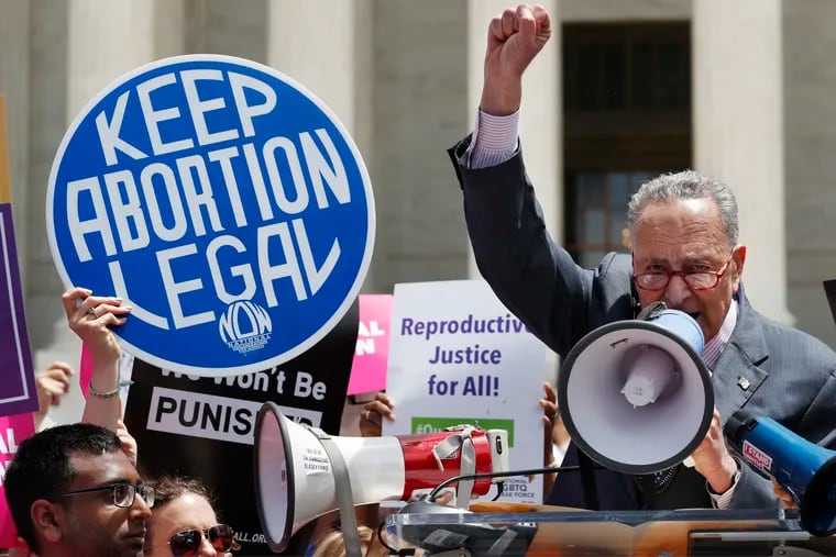 Senate Minority Leader Sen. Chuck Schumer (D, N.Y.) speaks during a protest against abortion bans on May 21 outside the Supreme Court in Washington.