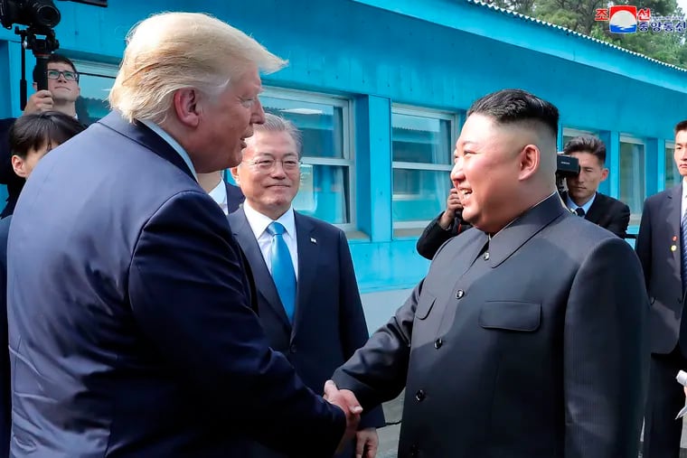In this Sunday, June 30, 2019, photo provided by the North Korean government, North Korean leader Kim Jong Un, right, bids farewell to U.S. President Donald Trump, left, and South Korean President Moon Jae-in, at the border village of Panmunjom in Demilitarized Zone. The content of this image is as provided and cannot be independently verified. Korean language watermark on image as provided by source reads: "KCNA" which is the abbreviation for Korean Central News Agency.