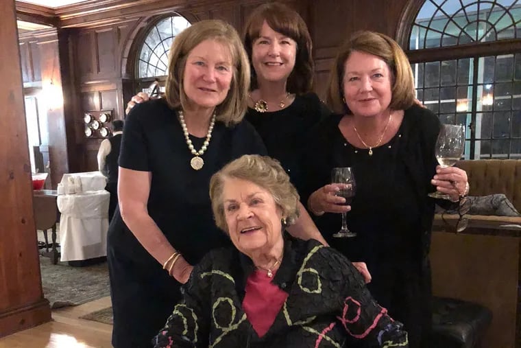 Mrs. Carney is surrounded by daughters, from left, Susan, Resie, and Carroll.