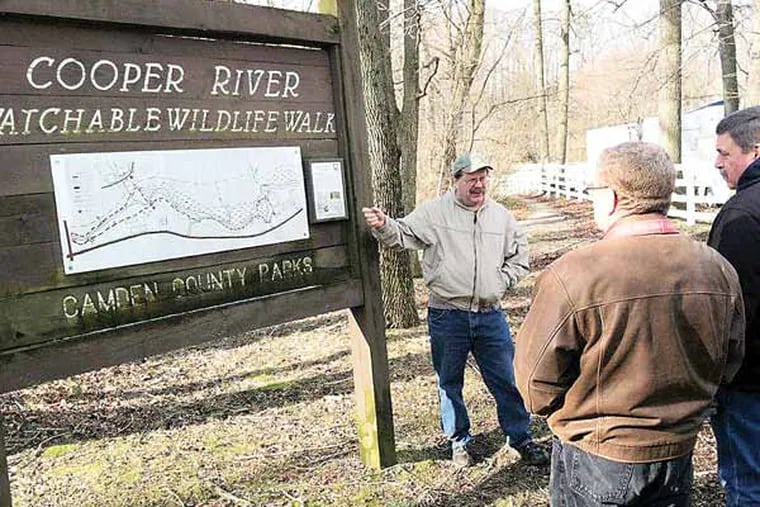Michael Hogan, of the South Jersey Land and Water Trust, at the start of a "Walk and Talk" along the upper Cooper River in Cherry Hill and Haddonfield on Sunday. About a dozen people took the 90-minute tour. Photo by Kevin Riordan
