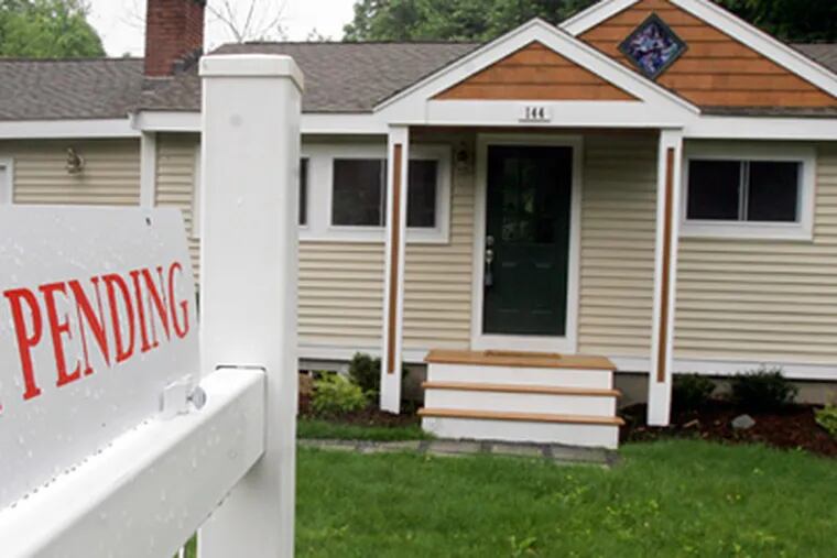 A house under contract in Framingham, Mass. With large numbers of purchase contracts going to settlement in May and June, sales should remain up through early summer, observers said. (Bill Sikes / Associated Press)