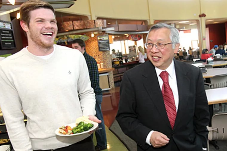 Bobby Fong, who recently completed his first semester as president of Ursinus College, with student Kevin Tallon. (Charles Fox / Staff Photographer)