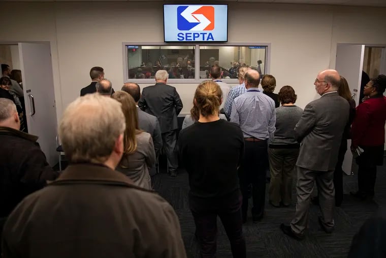 People gather during SEPTA's February board meeting.