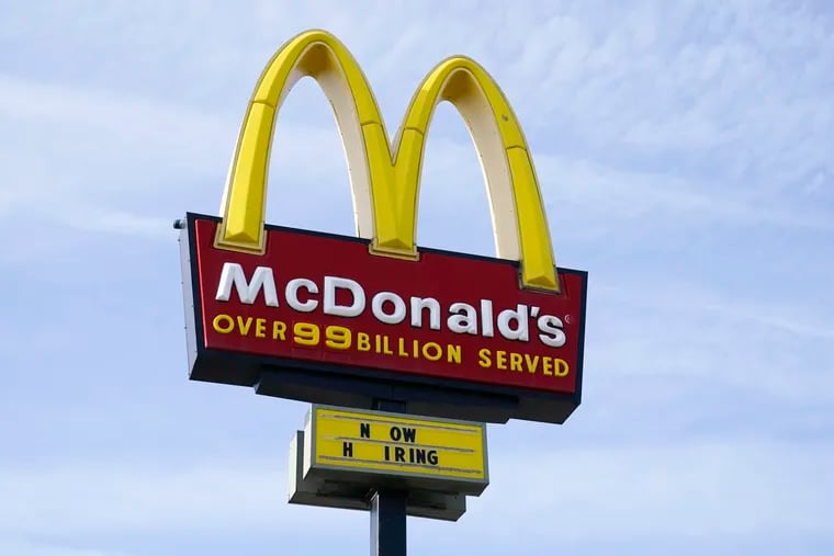 A sign is displayed outside a McDonald's restaurant, Tuesday, April 27, 2021, in Des Moines, Iowa.  McDonald’s said Tuesday, March 8, 2022,  it is temporarily closing all of its 850 restaurants in Russia in response to the country's invasion of Ukraine. The burger giant said it will continue paying its 62,000 employees in Russia.