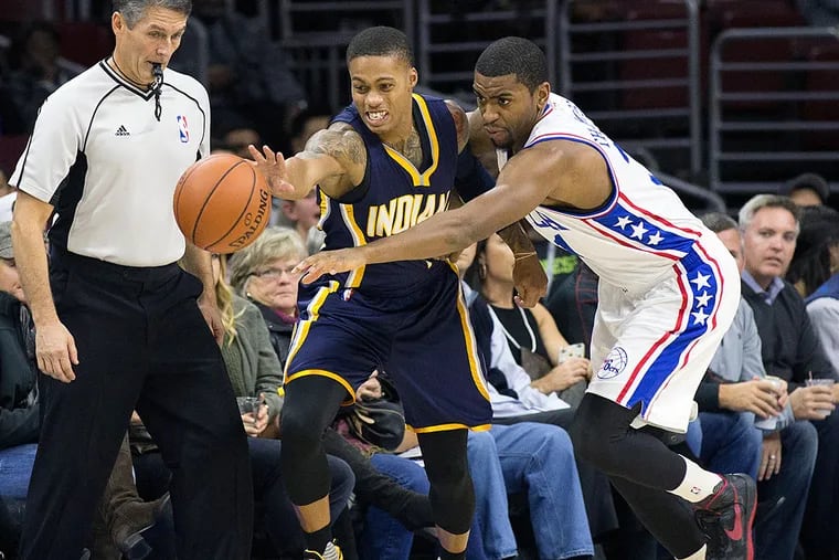 Indiana Pacers guard Joe Young (1) and Philadelphia 76ers guard Hollis Thompson (31) battle for a loose ball during the first quarter at Wells Fargo Center.