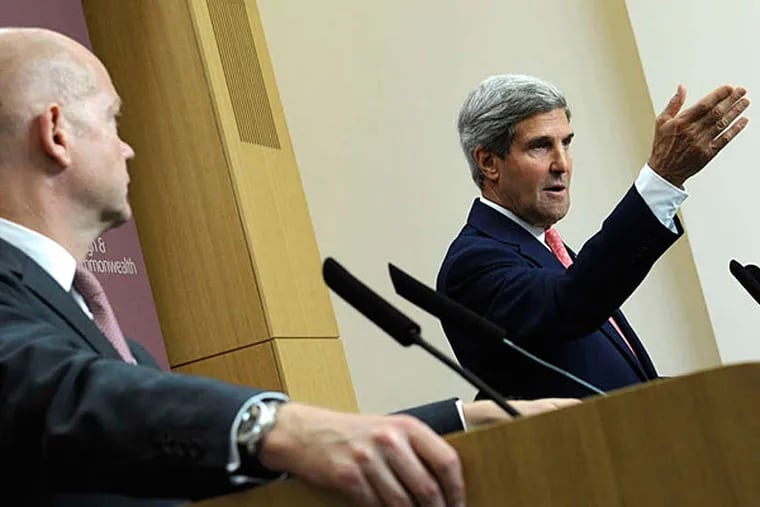 Secretary of State John Kerry with British Foreign Minister William Hague in London, where he said any Syrian strike would be &quot;unbelievably small.&quot; (Susan Walsh/AP)