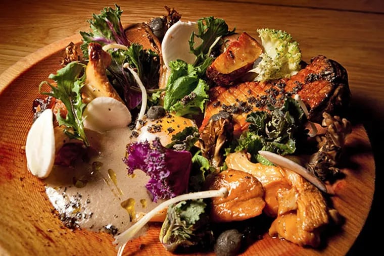 A medley of exotic mushrooms is served with sunchokes, smoky eggplant, young kale, and a farm-fresh egg at High Street.