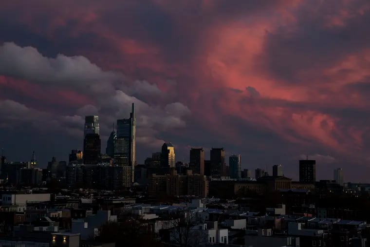 Color fills the sky as the sun sets over the skyline, as seen from Brewerytown in Philadelphia, Pennsylvania on Tuesday, November 12, 2019. Overnight temperatures are expected to bottom out at 20 degrees.