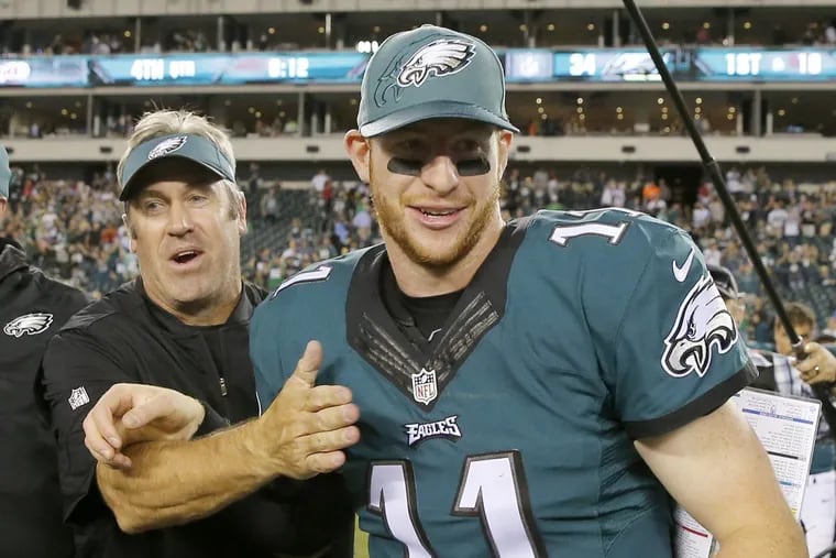 Eagles quarterback Carson Wentz and coach Doug Pederson after a victory over the Steelers last September.