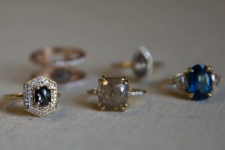 Rings designed by Lauren Priori are photographed in her Center City office on Thursday, May 02, 2019. Priori is a jewelry designer who custom designs engagement rings for people.