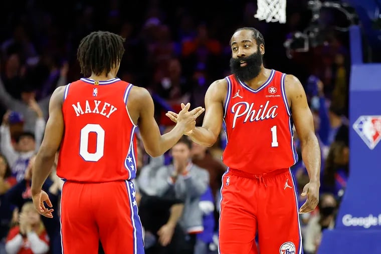 Sixers guard Tyrese Maxey shakes hands with teammate James Harden after a Maxey made basket against the Toronto Raptors in the second quarter during game two of the Eastern Conference quarterfinals playoffs on Monday, April 18, 2022 in Philadelphia.