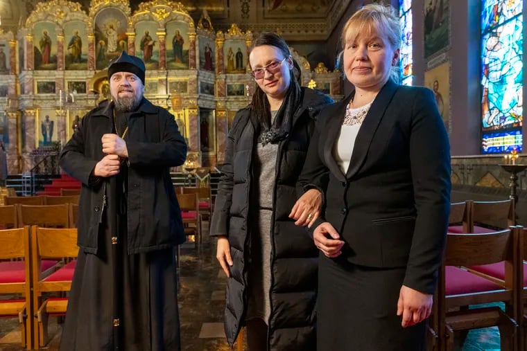 Ukrainian refugees Alla Pukhteska, (foreground/right) a theology teacher, and Veronika Matviienko, a choir director, are taking refuge from the war in the Ukraine at the St. Nicholas Orthodox Cathedral, N. 7th Street, Philadelphia. The two women arrived via NY. Photograph taken at the St. Nicholas Orthodox Cathedral on Wednesday morning March 30, 2022. At far left is Bishop Luke {Zhoba}