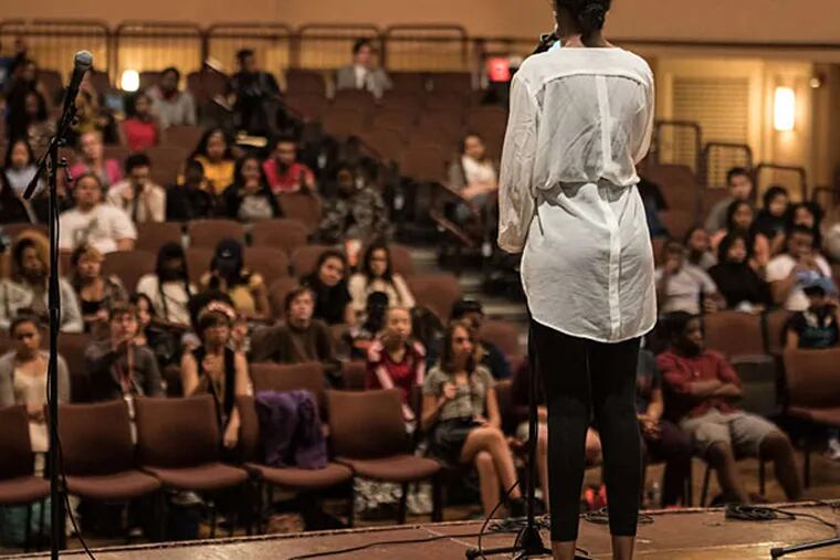 Cabria Trawick, a student at KIPP, performs a poem at the Philadelphia Youth Poetry Movement Slam League semifinal Friday at the University of the Arts. (MATTHEW HALL / For The Inquirer)
