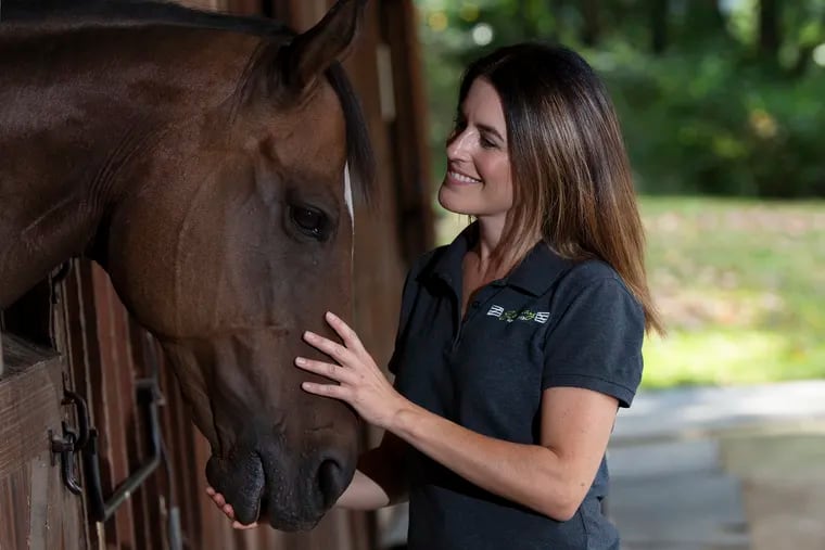 Kristen de Marco is photographed near the horses at the Gateway Horseworks stable in Malvern.