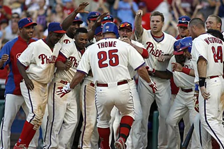 Jim Thome lifted the Phillies over the Rays with a pinch-hit, walk-off home run in the bottom of the ninth. (H. Rumph Jr/AP)