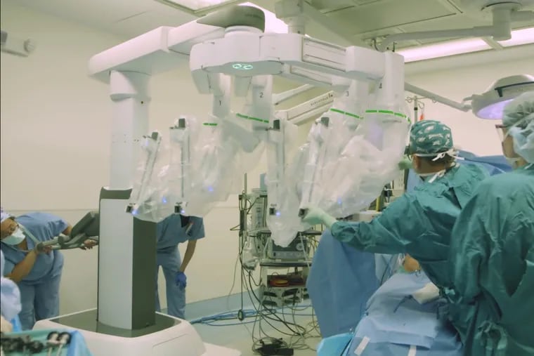 Surgeons at the University of Pennsylvania set up for the world's first robot-assisted double breast reconstruction using a flap of abdominal tissue