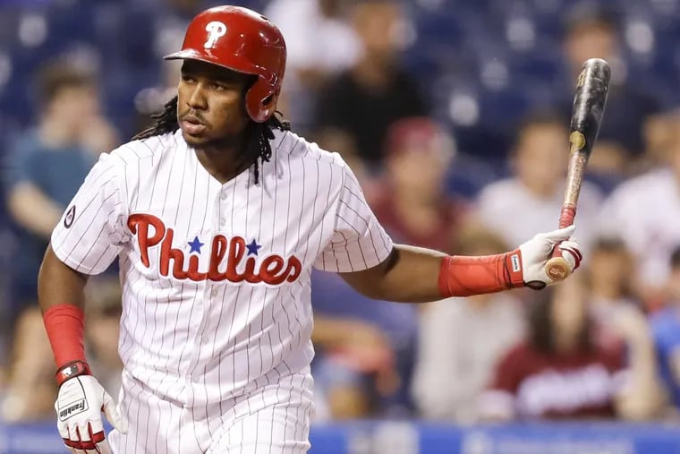 Phillies Maikel Franco prepares to toss his bat after drawing a walk against the Marlins on September 14.