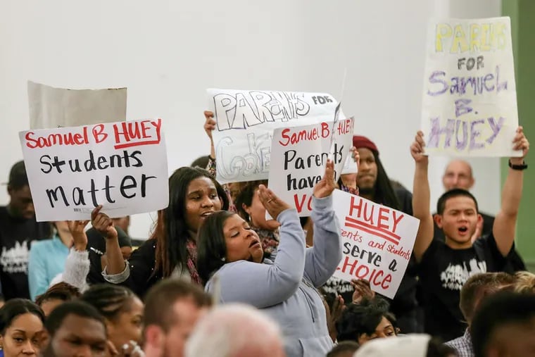 Opponents of a charter-school switch protest during the SRC meeting. The gathering was rowdy at times, and in the end, the School Reform Commission moved 3 schools closer to charters, overruling the superintendent on one.