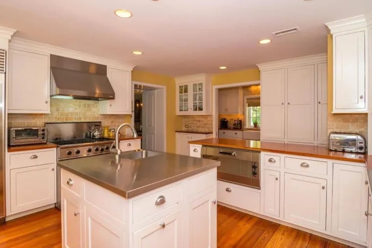 The kitchen of this Plymouth Meeting home includes a custom pizza oven.