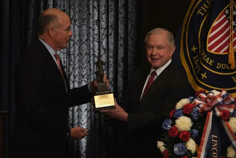 Attorney General Jeff Sessions receives the Lincoln Award from Union League President James P. Dunigan, left, during Lincoln Day ceremonies in Philadelphia on Monday, Feb. 12, 2018.