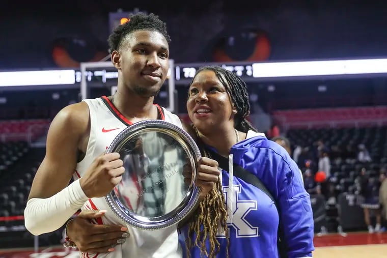 Imhotep’s Justin Edwards, posing with his mother, Ebony Twiggs, after winning MVP of the Public League championship game, is coming off winning a PIAA title with the Panthers.