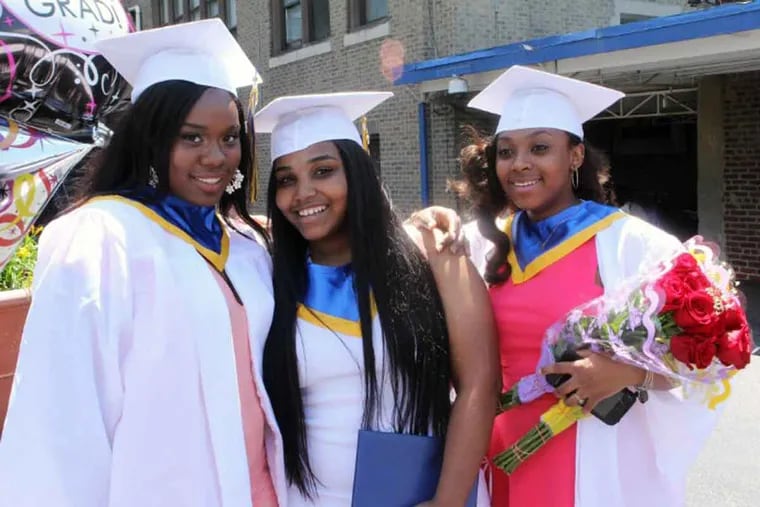 Akyra Murray (far left) and friends at their high school graduation.