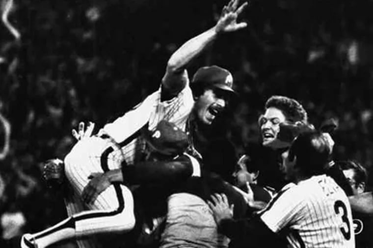 Mike Schmidt and other Phillies celebrate their World Series triumph on the night of Oct. 21, 1980. Schmidt also was the National League's most valuable player that season. (File photo)