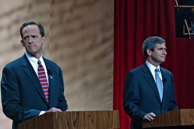 Pat Toomey (R) (left) and Joe Sestak (D) on stage before the start of the first debate of their campaign at the National Constitution Center, Oct. 20, 2010. ( David M Warren / Staff Photographer )