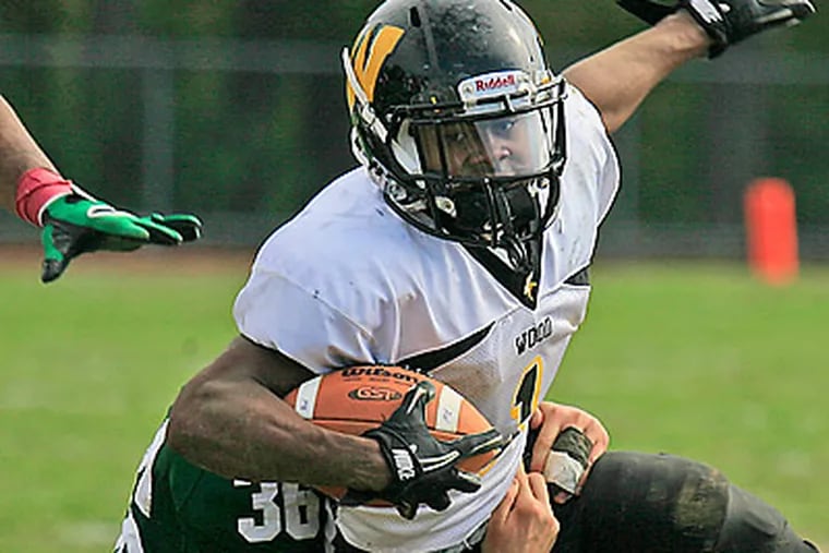 Running back Desmon Peoples is one of six Division I-A-bound players at Archbishop Wood this year. (Akira Suwa/Staff file photo)