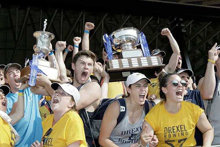 Drexel University rowers and fans celebrate after Drexel won the mens
division and was also named the overall winner of the 2015 Aberdeen
Dad Vail Regatta in Phila. on May 9, 2015.  (Elizabeth Robertson/
Staff Photographer)