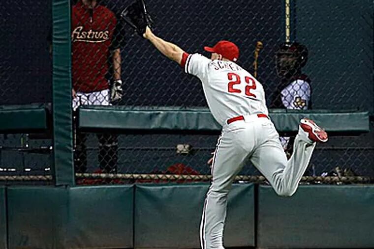 Nate Schierholtz reaches for the eventual game-winning double in the Phillies loss to the Astros. (David J. Phillip/AP)